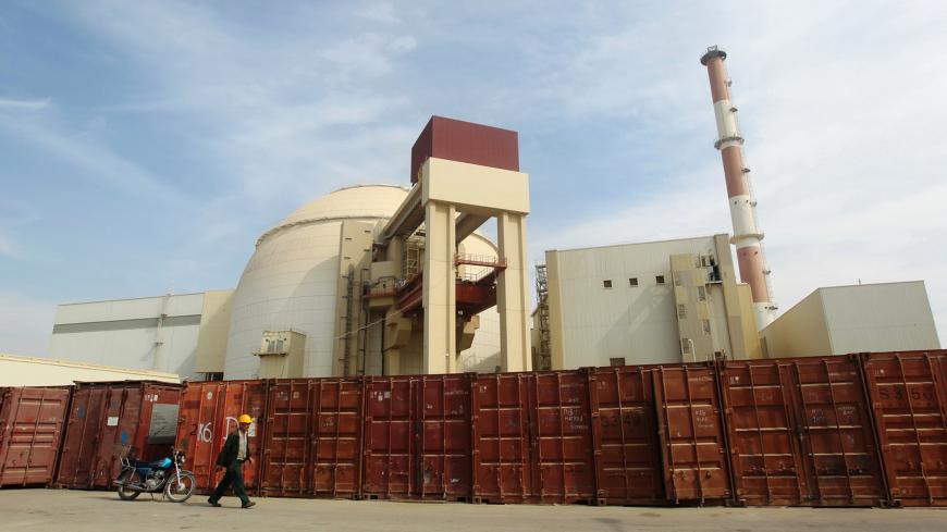 A Russian worker walks past the Bushehr nuclear power plant, 1,200 km (746 miles) south of Tehran October 26, 2010. Iran has begun loading fuel into the core of its first nuclear power plant on Tuesday, one of the last steps to realising its stated goal of becoming a peaceful nuclear power, state-run Press TV reported on Tuesday. REUTERS/Mehr News Agency/Majid Asgaripour (IRAN - Tags: POLITICS ENERGY IMAGES OF THE DAY) - GM1E6AQ1FIY01
