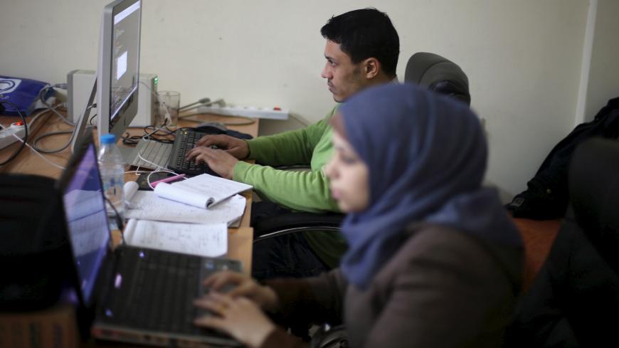 Young Palestinian entrepreneurs use their computers at Gaza Sky Geeks office, in Gaza City January 18, 2016. Picture taken January 18, 2016. REUTERS/Ibraheem Abu Mustafa  - GF20000107628