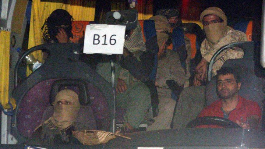 A convoy of Islamic State fighters and their families begin to depart from the Lebanon-Syria border zone in Qalamoun, Syria August 28, 2017. REUTERS/ Omar Sanadiki - RC15AA1676A0