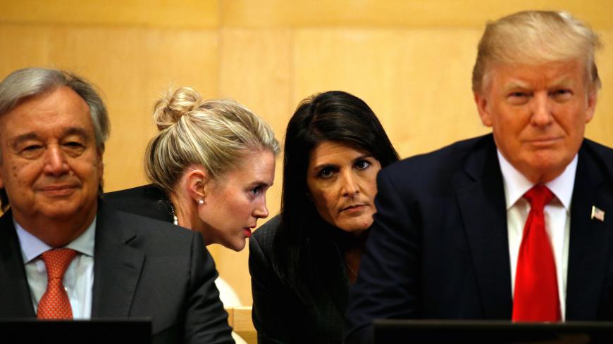 U.S. Ambassador to the UN Nikki Haley (2nd R) receives information, as U.S. President Donald Trump and UN Secretary General Antonio Guterres participate in a session on reforming the United Nations at UN Headquarters in New York, U.S., September 18, 2017. REUTERS/Kevin Lamarque - RC12FAAB1990