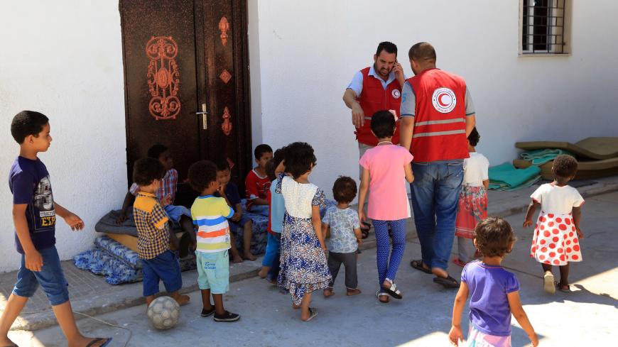 A picture taken on August 2, 2017 shows children of Islamic State (IS) group fighters currently living in the Libyan Red Crescent headquarters in Misrata, a town half-way between Sirte and Tripoli. 
Traumatised by war, their jihadist parents either killed or missing, twenty-eight children have found solace in each other at a Red Crescent centre in the Libyan city of Misrata. Whether they're jumping up and down on mattresses or playing in the yard, the boys and girls stick together, like siblings, the older 