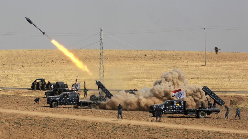 TOPSHOT - A picture taken on October 26, 2017 shows rockets being launched from Iraqi security forces' against Kurdish Peshmerga positions in the area of Faysh Khabur, which is located on the Turkish and Syrian borders in the Iraqi Kurdish autonomous region. / AFP PHOTO / AHMAD AL-RUBAYE        (Photo credit should read AHMAD AL-RUBAYE/AFP/Getty Images)