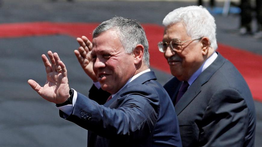 Jordan's King Abdullah II and Palestinian President Mahmoud Abbas wave during a reception ceremony in the West Bank city of Ramallah, August 7, 2017. REUTERS/Mohamad Torokman     TPX IMAGES OF THE DAY - RC193C6B9930