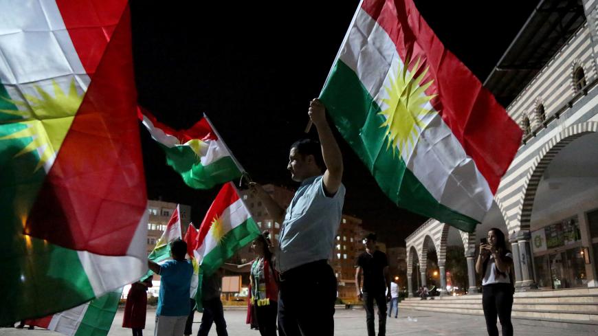 People wave Kurdish flags in Diyarbakir, Turkey September 25, 2017. REUTERS/Sertac Kayar - RC1EC9B78810