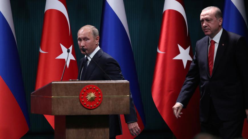 Turkish President Tayyip Erdogan and Russian President Vladimir Putin arrive for a press conference in Ankara, Turkey, September 28, 2017. REUTERS/Umit Bektas - RC1FB3502600