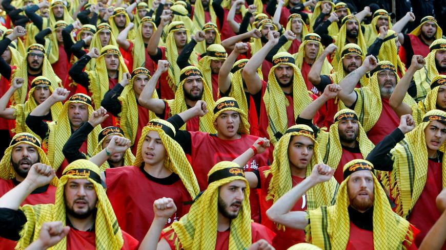 Supporters of Lebanon's Hezbollah party parade to mark the last day of Ashura ceremony in Beirut, Lebanon October 1, 2017. REUTERS/Aziz Taher - RC1894733A70