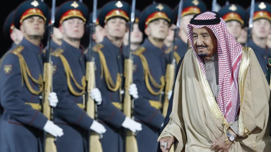 Saudi Arabia's King Salman walks past Russian honour guards during a welcoming ceremony upon his arrival at Vnukovo airport outside Moscow, Russia October 4, 2017. REUTERS/Sergei Karpukhin - UP1EDA41BJO47
