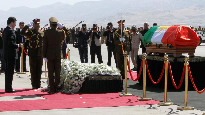 Iraq's Kurdish Regional Prime Minister Nechirvan Barzani prays in front of the coffin of former Iraqi president Jalal Talabani at Sulaimaniya Airport, Iraq October 6, 2017. REUTERS/Ako Rasheed - RC19229B2540