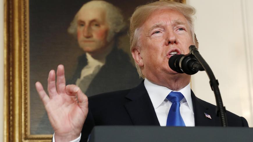 U.S. President Donald Trump speaks about Iran and the Iran nuclear deal in front of a portrait of President George Washington in the Diplomatic Room of the White House in Washington, U.S., October 13, 2017. REUTERS/Kevin Lamarque - HP1EDAD1BXDA9