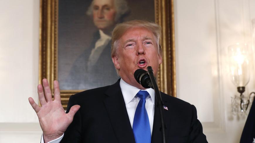 U.S. President Donald Trump speaks about Iran and the Iran nuclear deal in front of a portrait of President George Washington in the Diplomatic Room of the White House in Washington, U.S., October 13, 2017. REUTERS/Kevin Lamarque - HP1EDAD1CBIAH