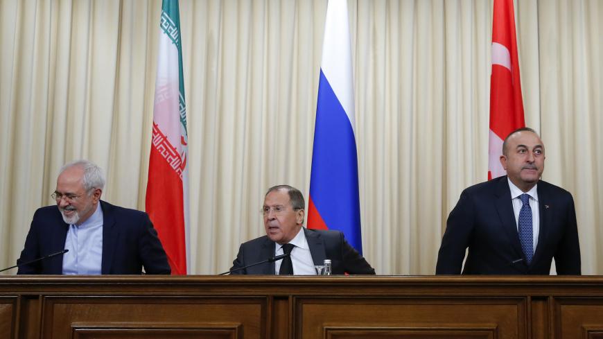 Foreign ministers, Sergei Lavrov (C) of Russia, Mevlut Cavusoglu (R) of Turkey and Mohammad Javad Zarif of Iran, attend a news conference in Moscow, Russia, December 20, 2016. REUTERS/Maxim Shemetov - LR1ECCK11GRTX