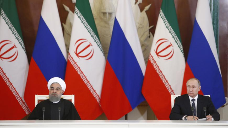 Russian President Vladimir Putin and Iranian President Hassan Rouhani attend a signing ceremony following their meeting at the Kremlin in Moscow, Russia March 28, 2017. REUTERS/Sergei Karpukhin - LR1ED3S15XREP
