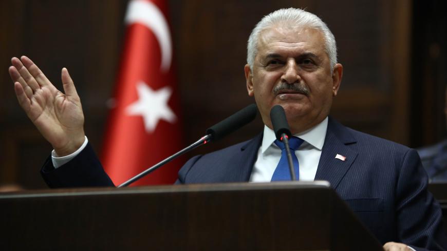 Turkish Prime Minister Binali Yildirim delivers a speech during the AK Party's group meeting at the Grand National Assembly of Turkey (TBMM) in Ankara on October 31, 2017. / AFP PHOTO / ADEM ALTAN        (Photo credit should read ADEM ALTAN/AFP/Getty Images)