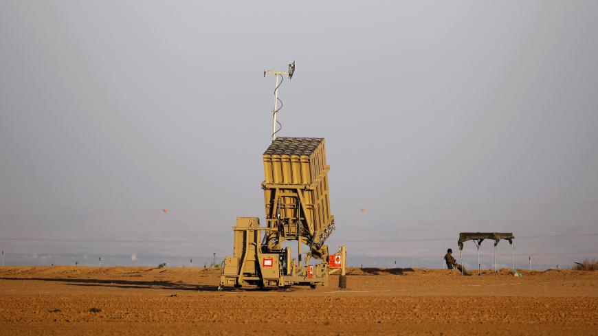 An Israeli soldier keeps watch by an Iron Dome rocket interceptor battery deployed near central Gaza Strip, southern Israel October 31, 2017. REUTERS/Amir Cohen - RC17FD29D770