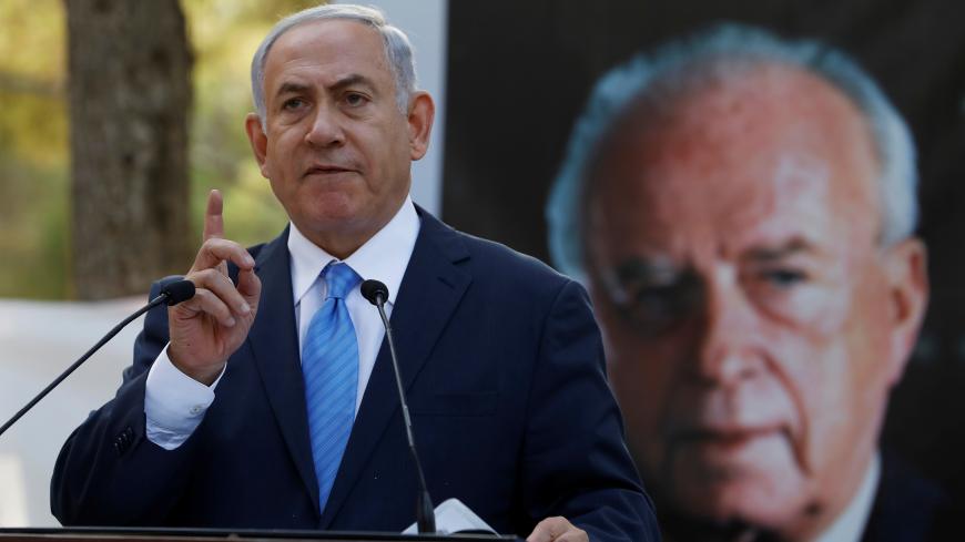 Israel's Prime Minister Benjamin Netanyahu attends a memorial ceremony for the late prime minister Yitzhak Rabin at Mount Herzl military cemetery in Jerusalem as Israel marks the 22nd anniversary of Rabin's killing by an ultra-nationalist Jewish assassin, November 1, 2017. REUTERS/Ronen Zvulun - RC1D75149620