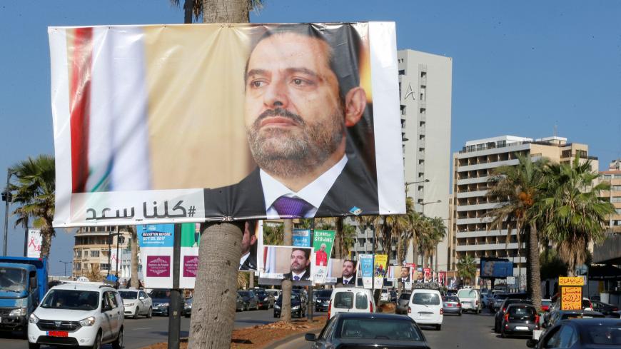 Posters depicting Lebanon's Prime Minister Saad al-Hariri, who has resigned from his post, are seen in Beirut, Lebanon, November 10, 2017. REUTERS/Mohamed Azakir - RC18F02935F0