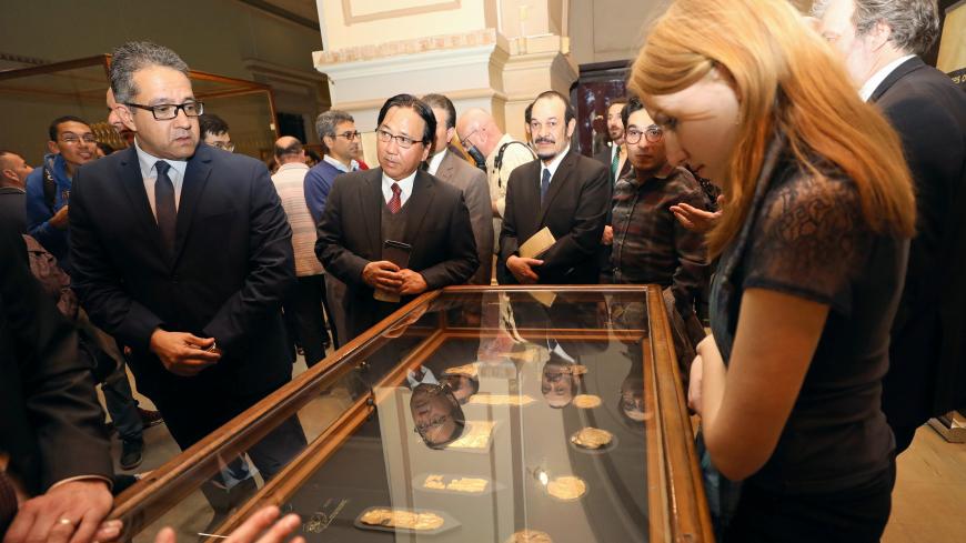 Egyptian Minister of Antiquities Khaled al-Anany looks at exhibits on display during the opening of "Tutankhamun's Unseen Treasures" exhibition at the Egyptian Museum in Cairo, Egypt November 15, 2017. Picture taken November 15, 2017. REUTERS/Mohamed Abd El Ghany - RC1594582550