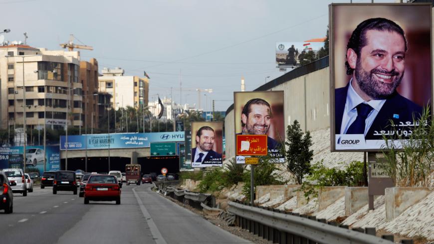Posters depicting Saad al-Hariri, who announced his resignation as Lebanon's prime minister from Saudi Arabia, is seen at airport high way in Beirut, Lebanon November 19, 2017. REUTERS/Jamal Saidi - RC119900A480