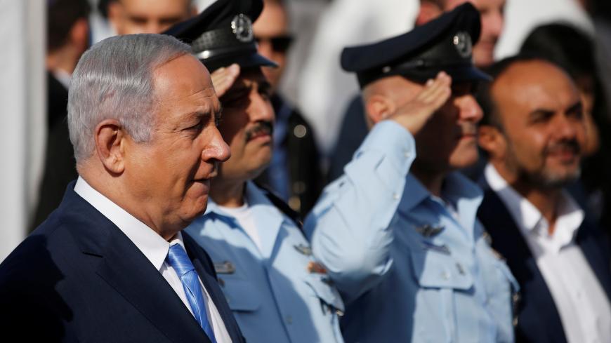 Israeli Prime Minister Benjamin Netanyahu (L) attends the inauguration ceremony of a police station in the Arab-Israeli town of Jisr ez-Zarqa November 21, 2017 REUTERS/Ronen Zvulun - RC1D4A2BB050