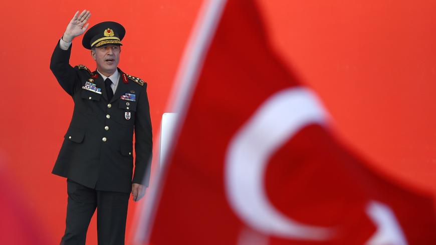 Turkey's Chief of the General Staff Hulusi Akar greets audience during the Democracy and Martyrs Rally, organized by Turkish President Tayyip Erdogan and supported by ruling AK Party (AKP), oppositions Republican People's Party (CHP) and Nationalist Movement Party (MHP), to protest against last month's failed military coup attempt, in Istanbul, Turkey, August 7, 2016.  REUTERS/Osman Orsal - LR1EC871BPP4E