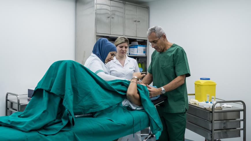 05.06.2014 - Beirut, Lebanon. A women is having her plastic surgery operation done at Innovi clinic Sodeco neighborhood. A surgery which is really common is the fat removal from legs, gluteus and abdomen to be used for facial treatment.