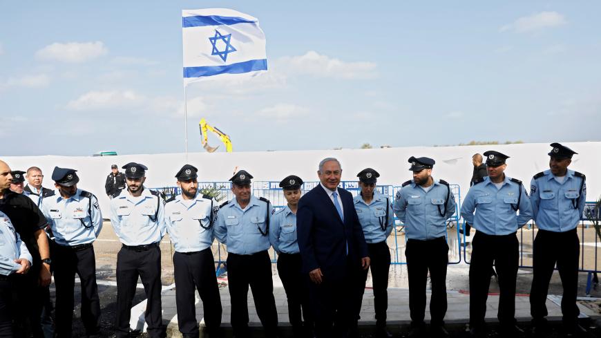 Israeli Prime Minister Benjamin Netanyahu attends the inauguration ceremony of a police station in the Arab-Israeli town of Jisr ez-Zarqa November 21, 2017. REUTERS/Ronen Zvulun - RC1BFB9D0670