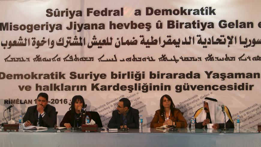 Bureau members of a preparatory conference to announce a federal system discuss a "Democratic Federal System for Rojava - Northern Syria" in the Kurdish-controlled town of Rmeilan, Hasaka province, Syria March 16, 2016. REUTERS/Rodi Said - GF10000347792