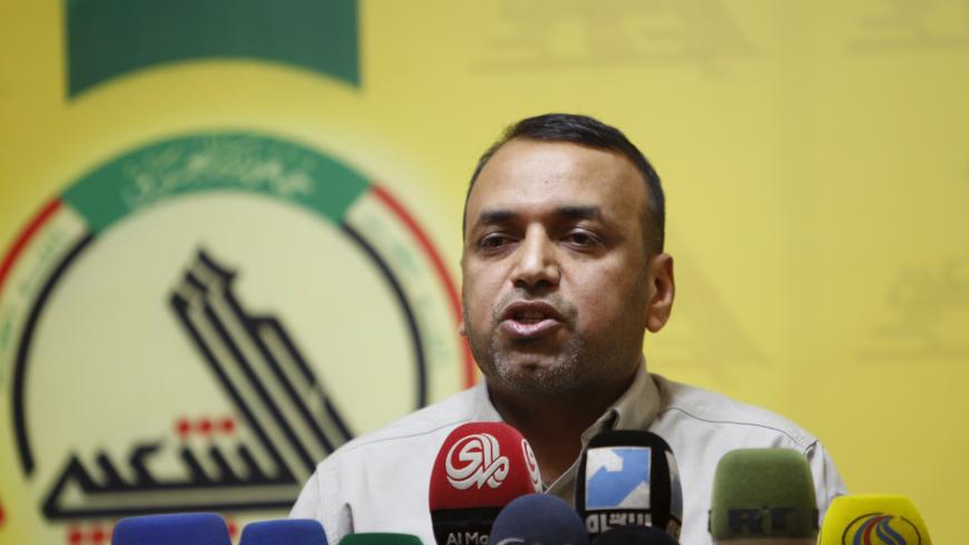Ahmed al-Asadi, spokeman for Shi'ite paramilitary group Hashd Shaabi, speaks during a news conference in Baghdad, July 2, 2015. Iraqi forces have cleared Islamic State militants from most of the northern town of Baiji and hope to drive them from the nearby oil refinery within days, a spokesman for the Shi'ite militias leading the fight said on Thursday. Al-Asadi said there were still "pockets of resistance" to the northeast and northwest of the town, and Islamic State fighters were trying to launch attacks 