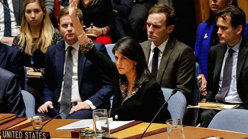 U.S. Ambassador to the United Nations Nikki Haley vetos an Egyptian-drafted resolution regarding recent decisions concerning the status of Jerusalem, during the United Nations Security Council meeting on the situation in the Middle East, including Palestine, at U.N. Headquarters in New York City, New York, U.S., December 18, 2017. REUTERS/Brendan McDermid - RC19707F9890