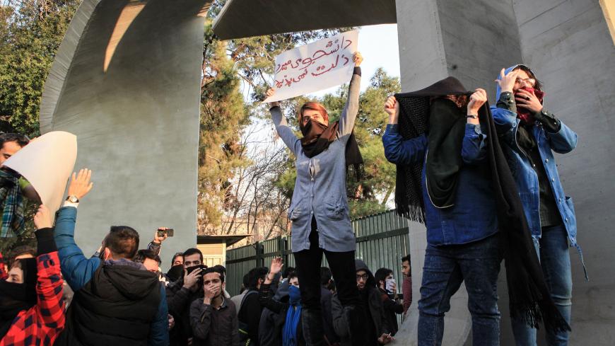 Iranian students protest at the University of Tehran during a demonstration driven by anger over economic problems, in the capital Tehran on December 30, 2017.
Students protested in a third day of demonstrations sparked by anger over Iran's economic problems, videos on social media showed, but were outnumbered by counter-demonstrators. / AFP PHOTO / STR        (Photo credit should read STR/AFP/Getty Images)