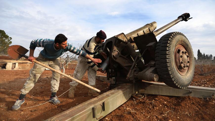 Opposition fighters prepare to fire missiles from a village near al-Tamanah during ongoing battles with government forces in Syria's Idlib province on January 11, 2018. 
The regime hopes to seize control of southeast parts of Idlib province to secure a main road between the capital Damascus and the northern city of Aleppo. / AFP PHOTO / OMAR HAJ KADOUR        (Photo credit should read OMAR HAJ KADOUR/AFP/Getty Images)