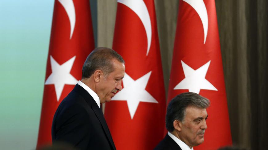 Turkey's new President Tayyip Erdogan (L) and outgoing President Abdullah Gul attend a handover ceremony at the Presidential Palace of Cankaya in Ankara August 28, 2014. Erdogan was sworn in as Turkey's 12th president at a ceremony in parliament on Thursday, cementing his position as the country's most powerful modern leader, in what his opponents fear will herald an increasingly authoritarian rule. REUTERS/Umit Bektas (TURKEY - Tags: POLITICS) - GM1EA8T00E601