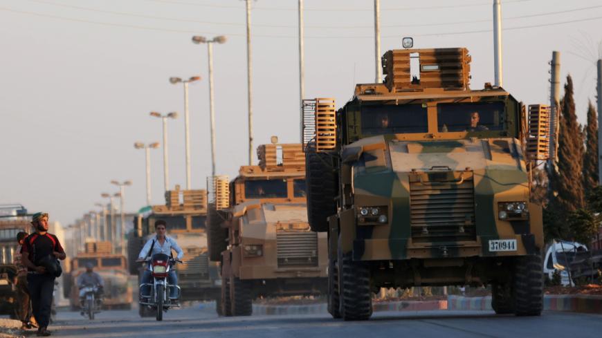 Turkish military convoy is seen in the northern Syrian rebel-held town of Al-Bab, Syria, September 28, 2017. REUTERS/Khalil Ashawi - RC1CBDDC6600