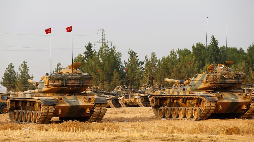Turkish army tanks and military personal are stationed in Karkamis on the Turkish-Syrian border in the southeastern Gaziantep province, Turkey, August 25, 2016. REUTERS/Umit Bektas - S1BETXLBLSAE