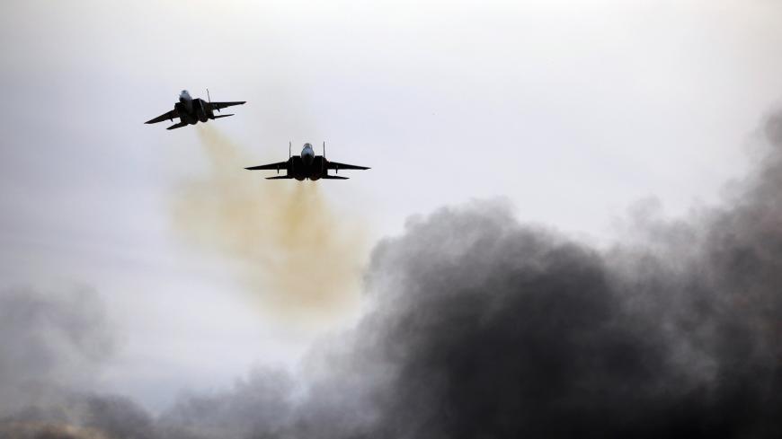 Israeli Air Force F-15 planes fly during an aerial demonstration at a graduation ceremony for Israeli air force pilots at the Hatzerim air base in southern Israel, December 27, 2017. REUTERS/Amir Cohen - RC157FBE1E80