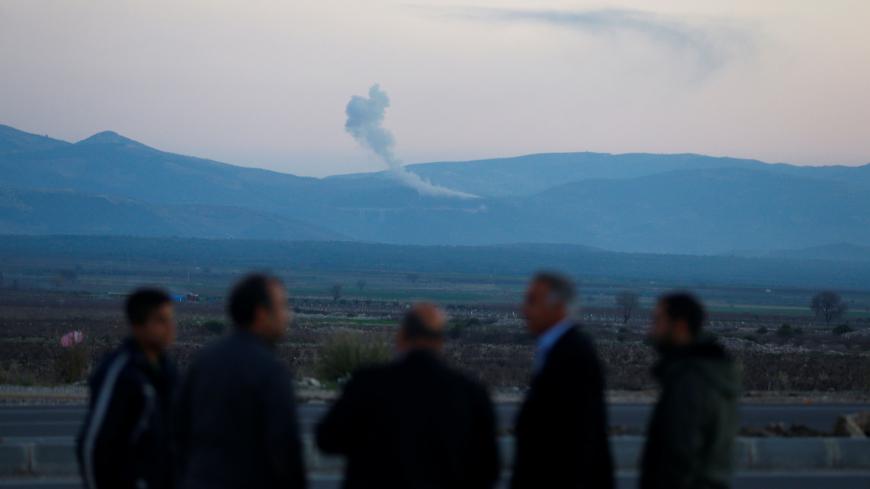 Smoke rises from the Syria's Afrin region, as it is pictured from near the Turkish town of Hassa, on the Turkish-Syrian border in Hatay province, Turkey January 20, 2018. REUTERS/Osman Orsal - RC1E9965CD20