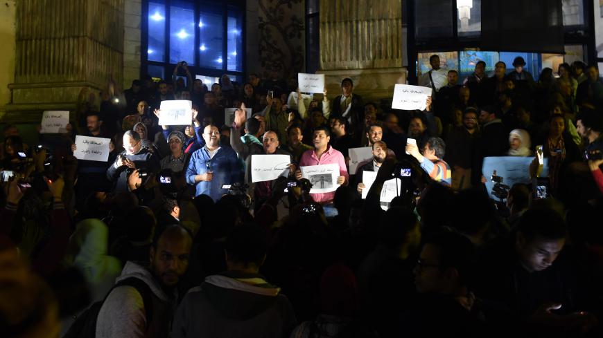 Journalists gather in front of the Journalists' Syndicate in Cairo on November 19, 2016, to protest against the courts verdict to sentence head of the union and two members to two years in prison.
Egypt's interior minister Magdy Abdel Ghaffar

Journalists Syndicate president Yahiya Kallash, Gamal Abd el-Rahim and Khaled Elbalshy were charged in May with sheltering two journalists wanted over protests against the transfer of two Red Sea islands to Saudi Arabia.

Their arrest following a May 1 police raid on 