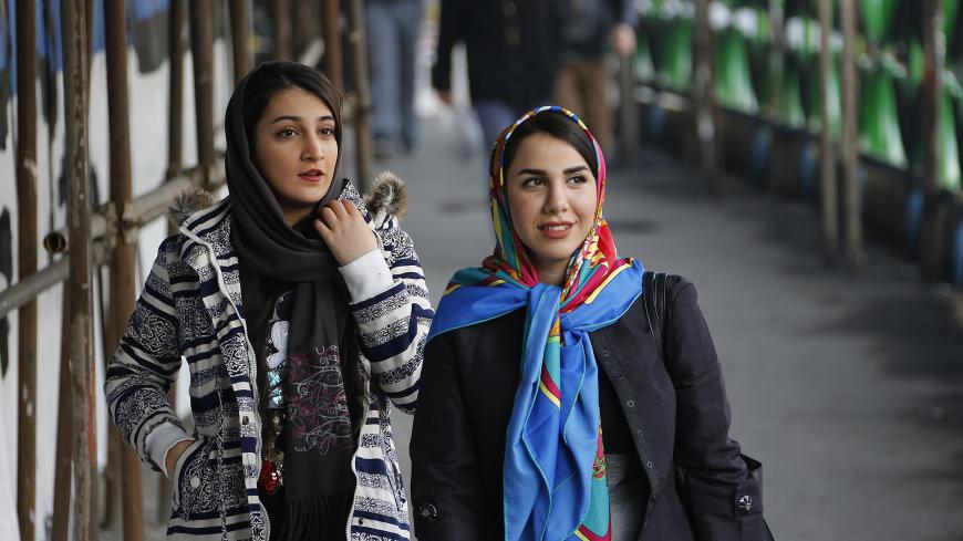 Iranian women wearing hijab walk down a street in the capital Tehran on February 7, 2018.
A spate of unprecedented protests against Iran's mandatory headscarves for women have been tiny in number, but have still reignited a debate that has preoccupied the Islamic republic since its founding. / AFP PHOTO / ATTA KENARE        (Photo credit should read ATTA KENARE/AFP/Getty Images)