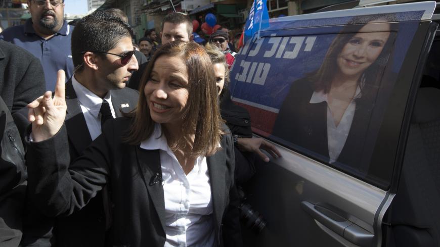 Labour party leader Shelly Yachimovich leaves after campaigning at the Mahne Yehuda market in Jerusalem January 16, 2013. In decline since the peace it sought with the Palestinians unravelled into violence, Israel's Labour Party looks set to regain some lost ground in next week's election after waging an economy-focused campaign. REUTERS/Ronen Zvulun (JERUSALEM - Tags: POLITICS ELECTIONS) - GM1E91G1OP101