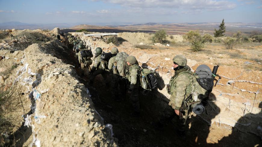 Turkish forces are seen on Mount Barsaya in northeast of Afrin, Syria January 28, 2018.REUTERS/ Khalil Ashawi - RC1E13D8A6D0