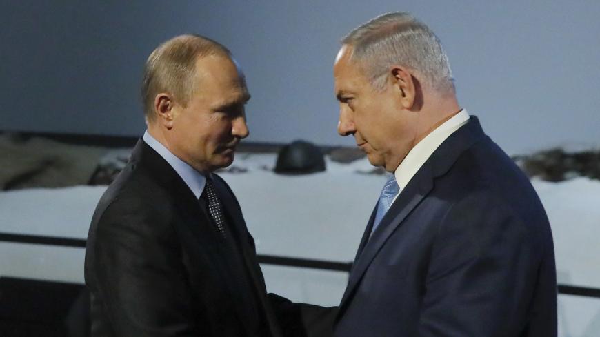 Russian President Vladimir Putin and Israeli Prime Minister Benjamin Netanyahu shake hands as they attend an event marking the International Holocaust Victims Remembrance Day and the 75th anniversary of the breakthrough the Nazi Siege of Leningrad in the World War II, at the Jewish Museum and Tolerance Centre in Moscow, Russia January 29, 2018. REUTERS/Maxim Shemetov - UP1EE1T16MCI6