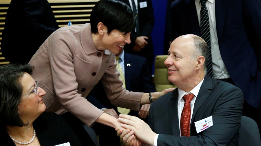 Norway's Foreign Minister Ine Marie Eriksen Soreide greets Israeli Minister of Regional Cooperation Tzachi Hanegbi during a session of the International Donor Group for Palestine at the EU Commission headquarters in Brussels, Belgium, January 31, 2018.  REUTERS/Francois Lenoir - RC15AF17F6A0
