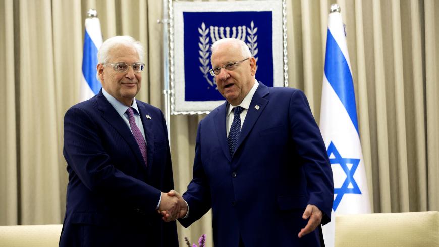 David Friedman (L), the newly appointed United States Ambassador to Israel, shakes hands with Israel's President Reuven Rivlin, during a ceremony whereby Rivlin received Friedman's diplomatic credentials at his residence in Jerusalem May 16, 2017. REUTERS/Heidi Levine/Pool - RC1CB682D2C0