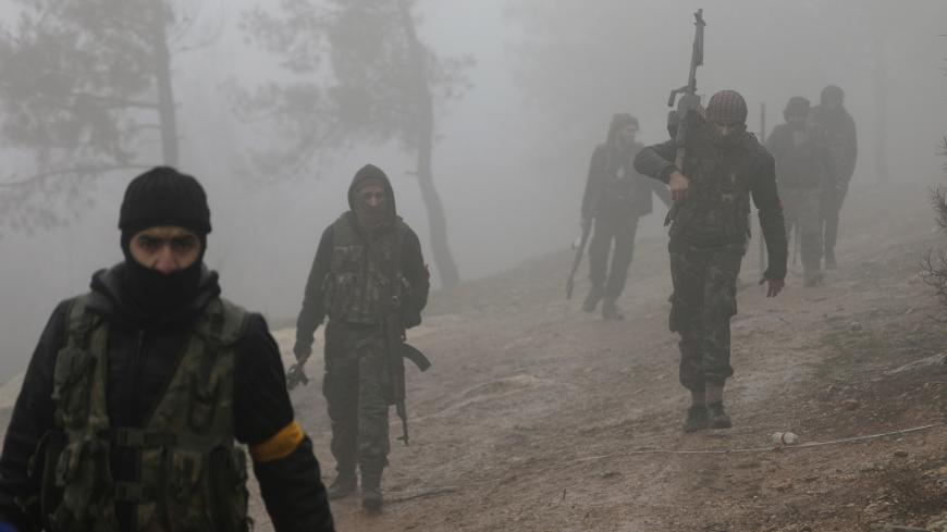 Turkish-backed Free Syrian Army fighters are seen near Mount Barsaya, northeast of Afrin, Syria January 23, 2018. REUTERS/Khalil Ashawi - RC17FC1FEC20