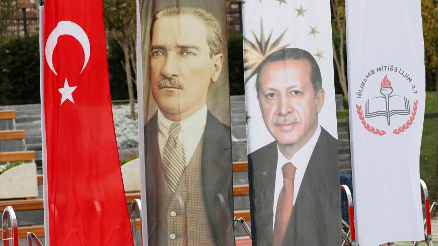Banners with pictures of modern Turkey's founder Ataturk and Turkish President Tayyip Erdogan are pictured during the opening ceremony of Recep Tayyip Erdogan Imam Hatip School in Istanbul, Turkey, September 29, 2017. Picture taken September 29, 2017.    To match Special Report TURKEY-ERDOGAN/EDUCATION     REUTERS/Murad Sezer - RC1E9AE58B80