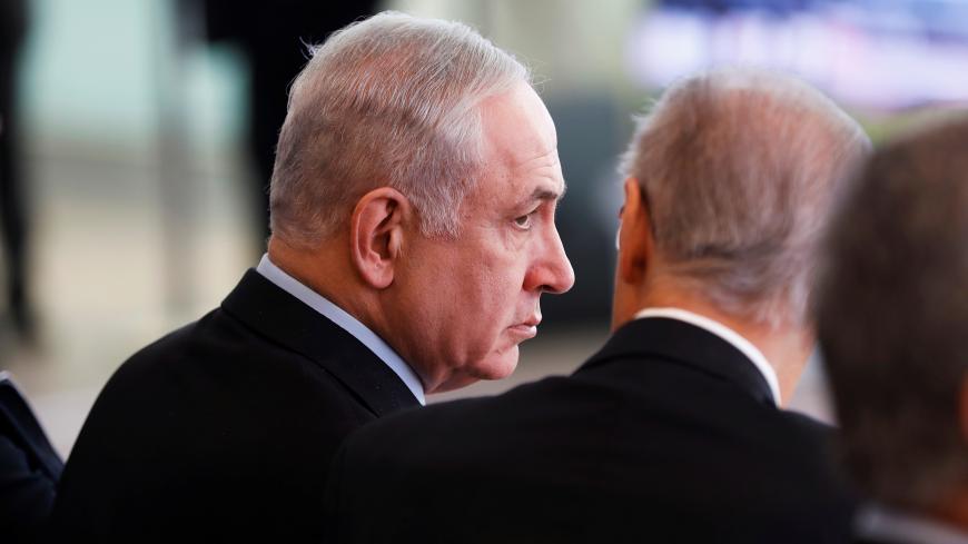 Israeli Prime Minister Benjamin Netanyahu looks on during the dedication ceremony of a new concourse at the Ben Gurion International Airport, near Lod, Israel February 15, 2018. REUTERS/Ronen Zvulun - RC1A4D1A1CE0