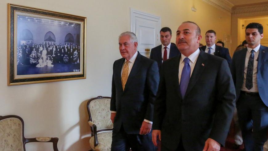 Turkish Foreign Minister Mevlut Cavusoglu and U.S. Secretary of State Rex Tillerson arrive to a meeting in Ankara, Turkey, February 16, 2018. REUTERS/Cem Ozdel/Pool - RC1EECDD07D0