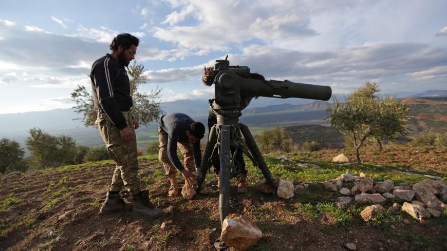 Turkish-backed Free Syrian Army fighters prepare a TOW anti-tank missile north of the city of Afrin, Syria February 18, 2018. REUTERS/Khalil Ashawi - RC1F6E636C20