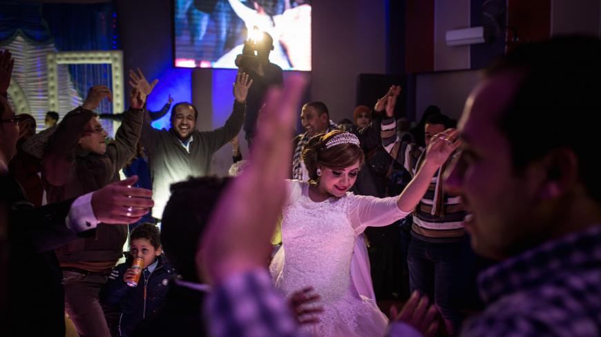CAIRO, EGYPT - DECEMBER 18: A bride dances during a traditional Egyptian wedding party on December 18, 2016 in Cairo, Egypt. Since the 2011 Arab Spring, Egyptians have been facing a crisis, the uprising brought numerous political changes, but also economic turmoil, increased terror attacks and the unravelling of the once strong tourism sector. In recent weeks Egypt has again been hit by multiple bomb blasts, the most recent killed 26 Christians inside the St Peter and St Paul Church during Sunday mass. As C