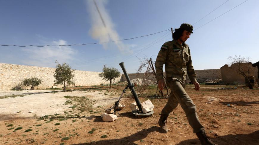 A rebel fighter fires a mortar shell towards Syrian army soldiers, west of Manbij city, in Aleppo Governorate, Syria March 9, 2017. REUTERS/Khalil Ashawi - RC1BFF190D80